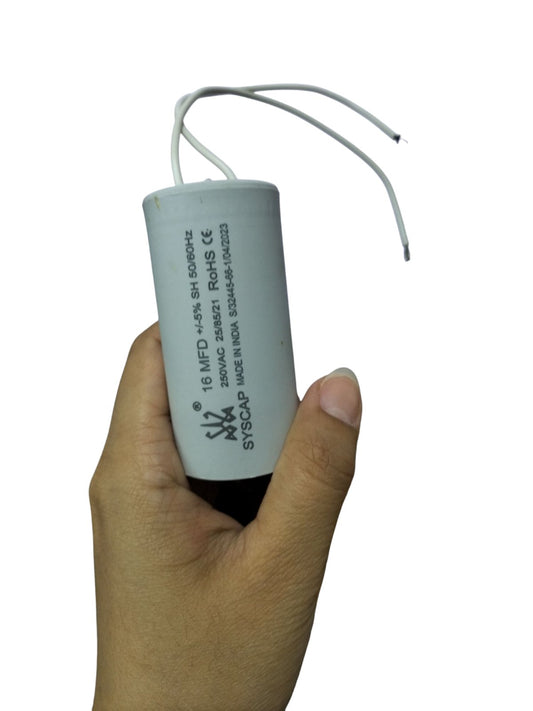 16MFD 250V AC Running Capacitor by Syscap held in a hand, showcasing its compact design and wire connections