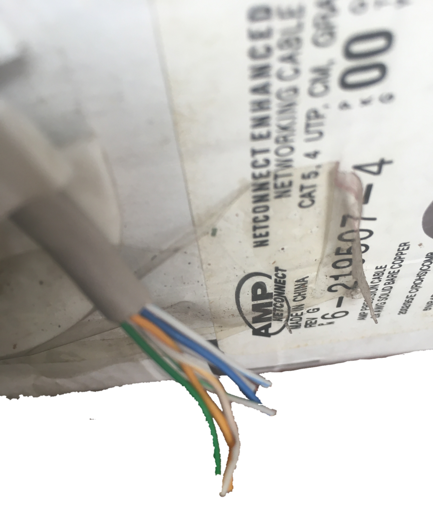 Close-up of AMP LAN Cable Stranded showing exposed twisted wire pairs from network cable