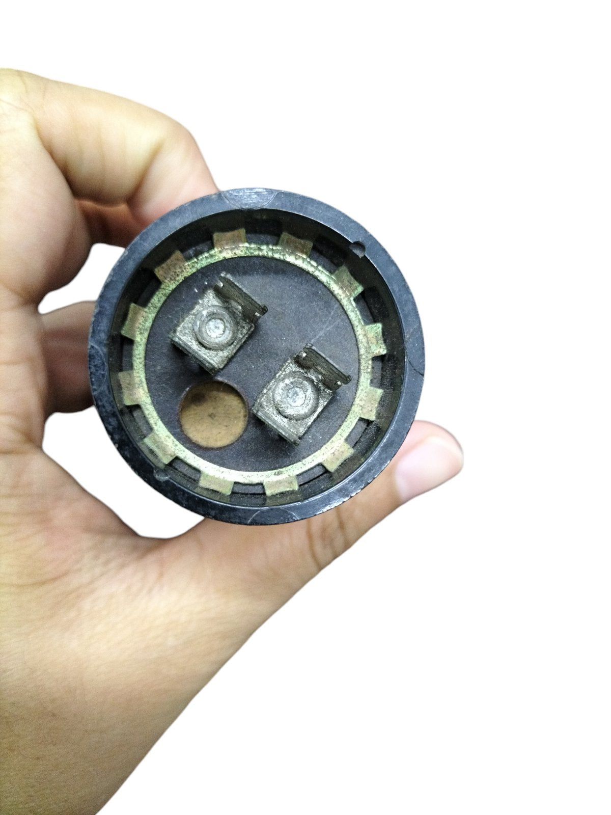 Close-up of a BMI 1000-1200uF Starting Capacitor showing terminal connections for electrical circuits