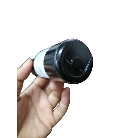 Hand holding a motor start capacitor 125V AC 430-516UF designed for electrical circuits