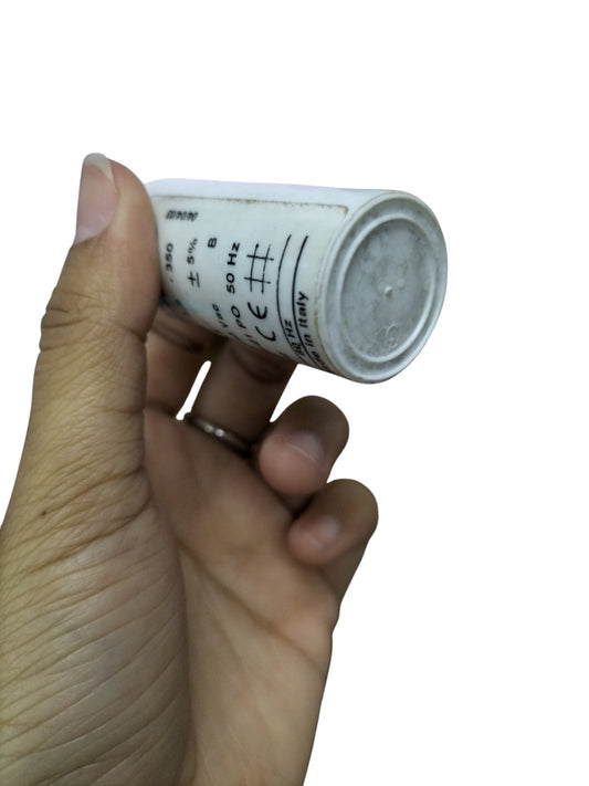 Comar Motor Running Capacitor 350V AC held in hand, ideal for improving motor performance