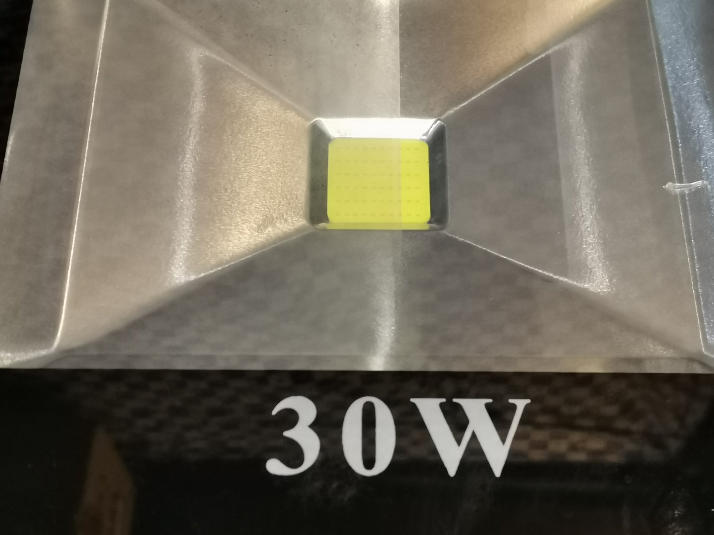 Close-up of DENKO 30W 220V outdoor LED light with reflective metal housing from Electx Electrical Supply