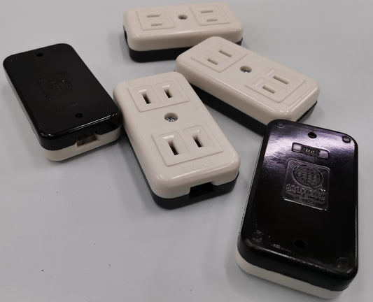 Eagle CAT2082 outlet adapter power points and switches with white and black covers on white surface