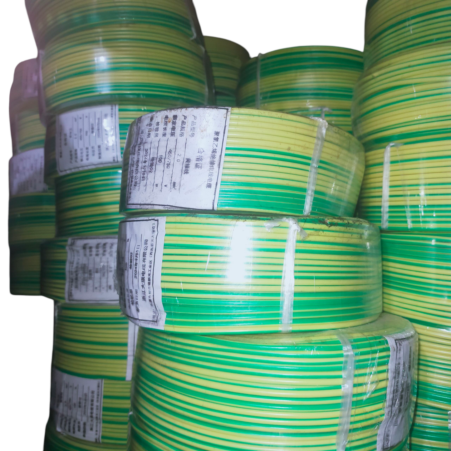 Rolls of green and yellow Grounding Cable 2.0mm AWG14 wires stacked with white labels