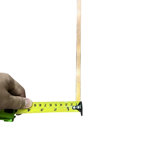 High current copper bus bar being measured with a tape measure for electrical applications