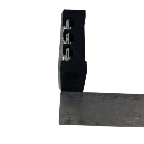 Grippes 45A 3 Pair Terminal Block 600V black plastic with three metal contacts shown beside ruler for scale