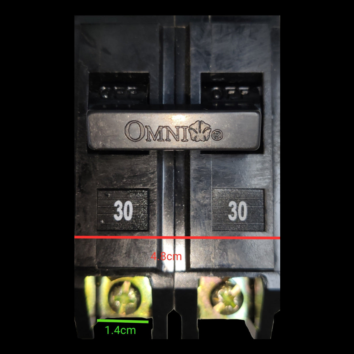 Omni 30A Circuit Breaker Plug-in Type electrical part with black casing and metal screws close-up