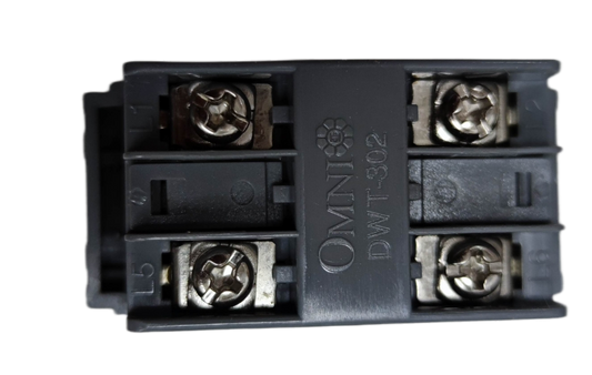 Omni graphite telephone wall jack module with four screw terminals close up for residential wiring