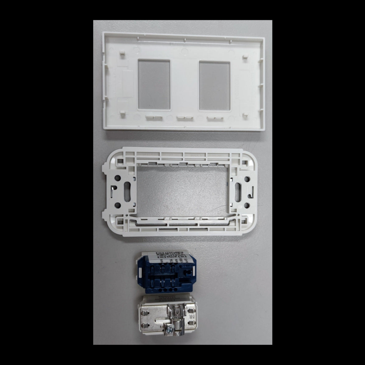 Panasonic Cable Outlet and Telephone Outlet components including white mounting frame and connectors
