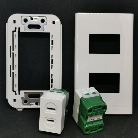 Panasonic WEG1001-5 WEG6802 outlet with a white switch plate and green power modules for electrical installations