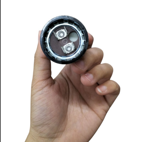 Mallory Starting Capacitor 36-43MFD 125V held in hand, showcasing its electrical components