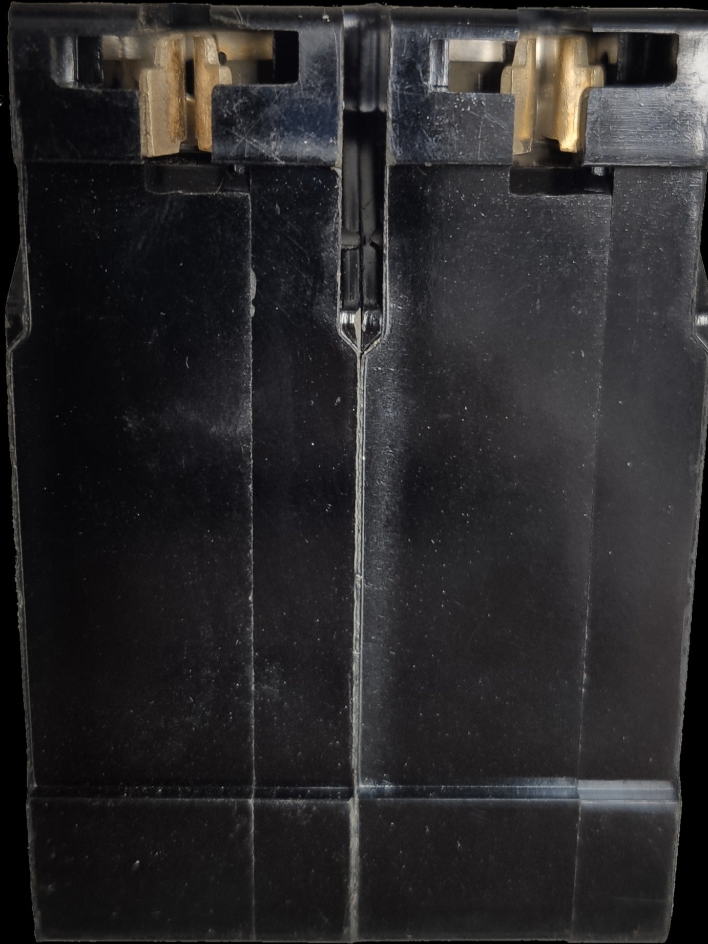 Close-up of Taiyou 15A 2 Pole Circuit Breaker showing black casing and brass connectors