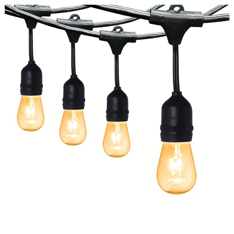 Close up of LED string lights warm white with black sockets hanging in a row for decorative lighting