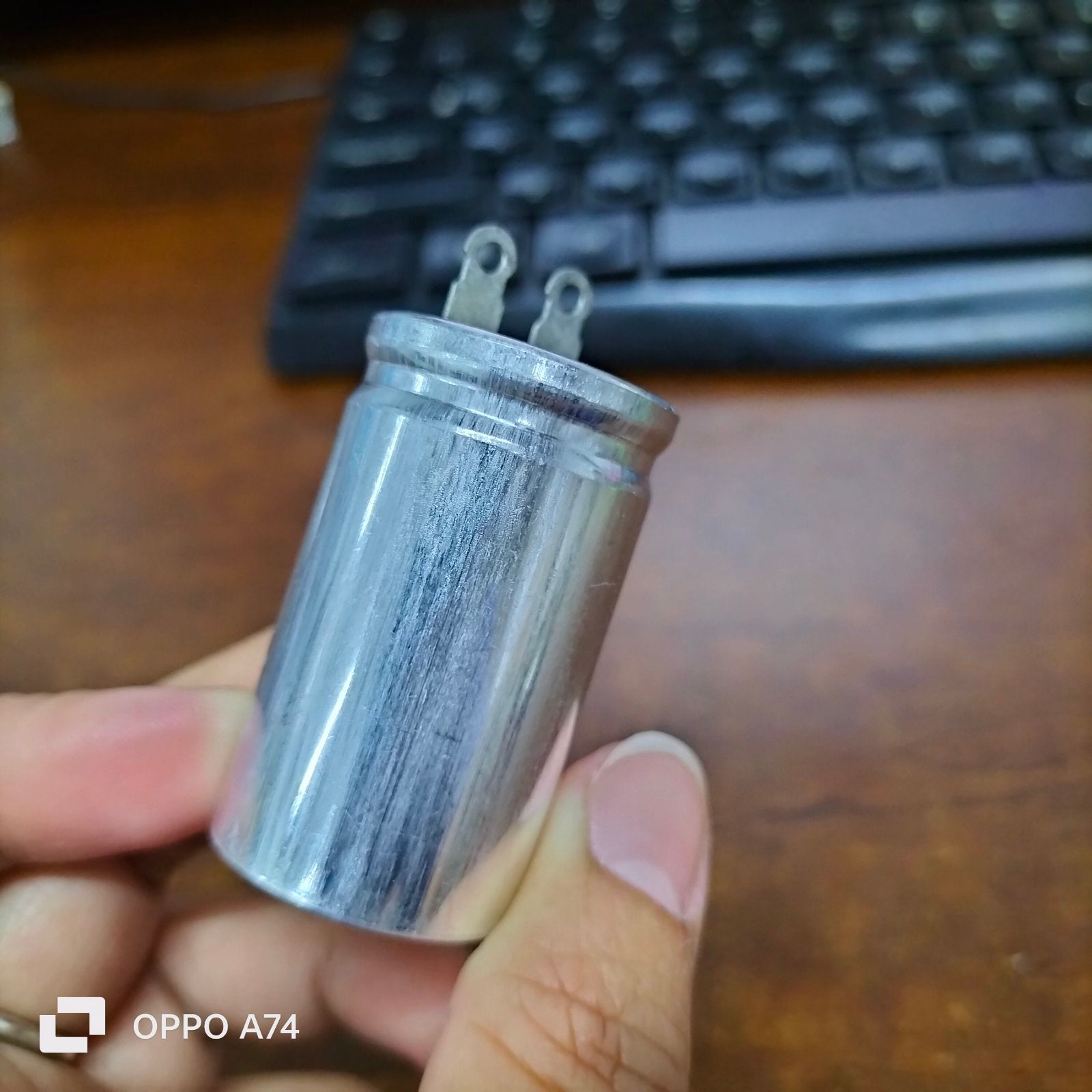 250V AC motor running capacitor with metal casing and terminal connectors for electrical applications