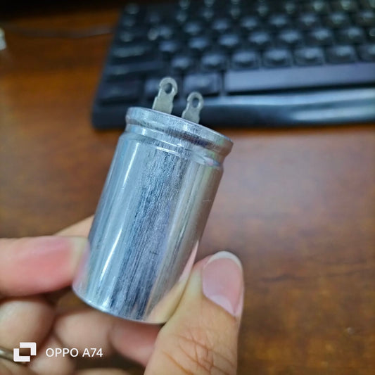 250V AC motor running capacitor with metal casing and terminal connectors for electrical applications