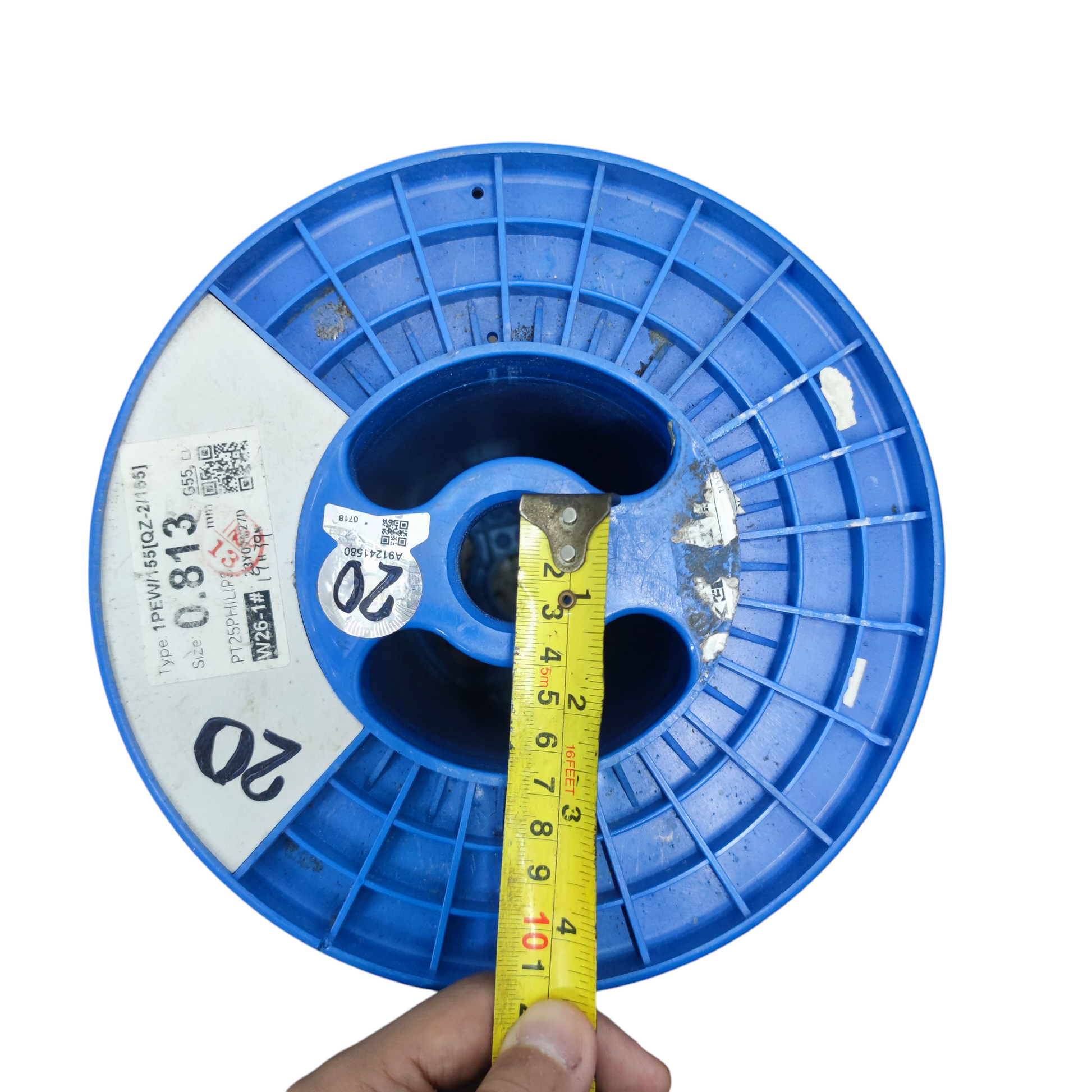 Top view of a blue 25kg plastic spool for wire with measurement tape for size reference