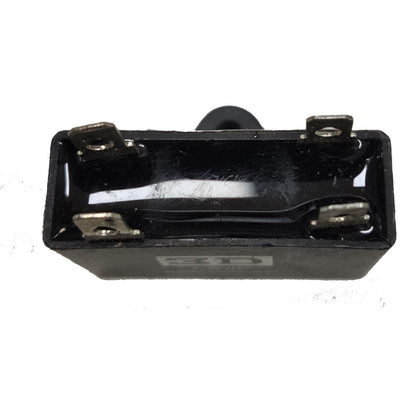 Black rectangular component with metal contacts on a white background