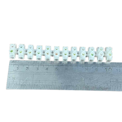 Grippes 5A PVC terminal block 12 pairs shown with a ruler for size reference