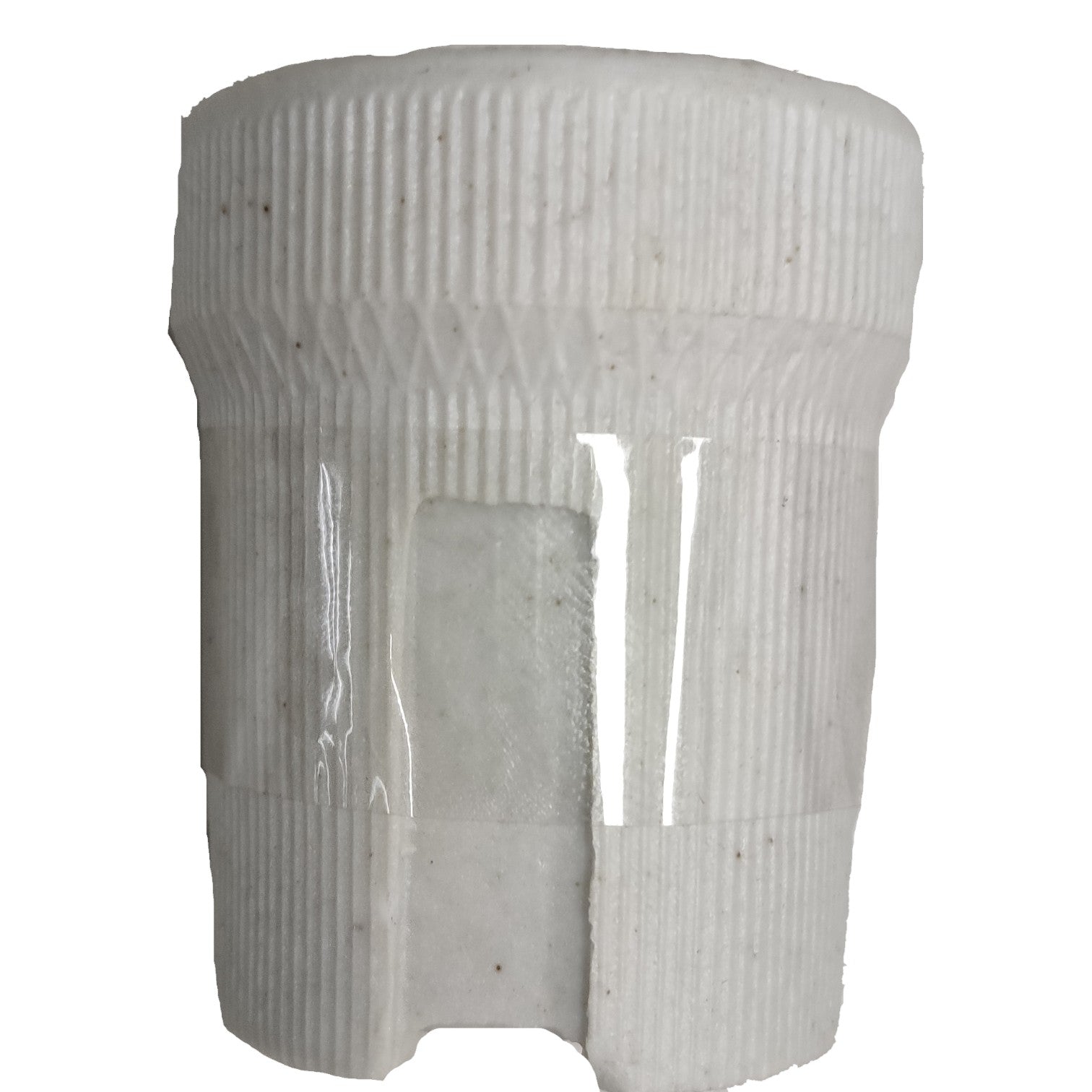 White cylindrical object with ribbed texture on a white background