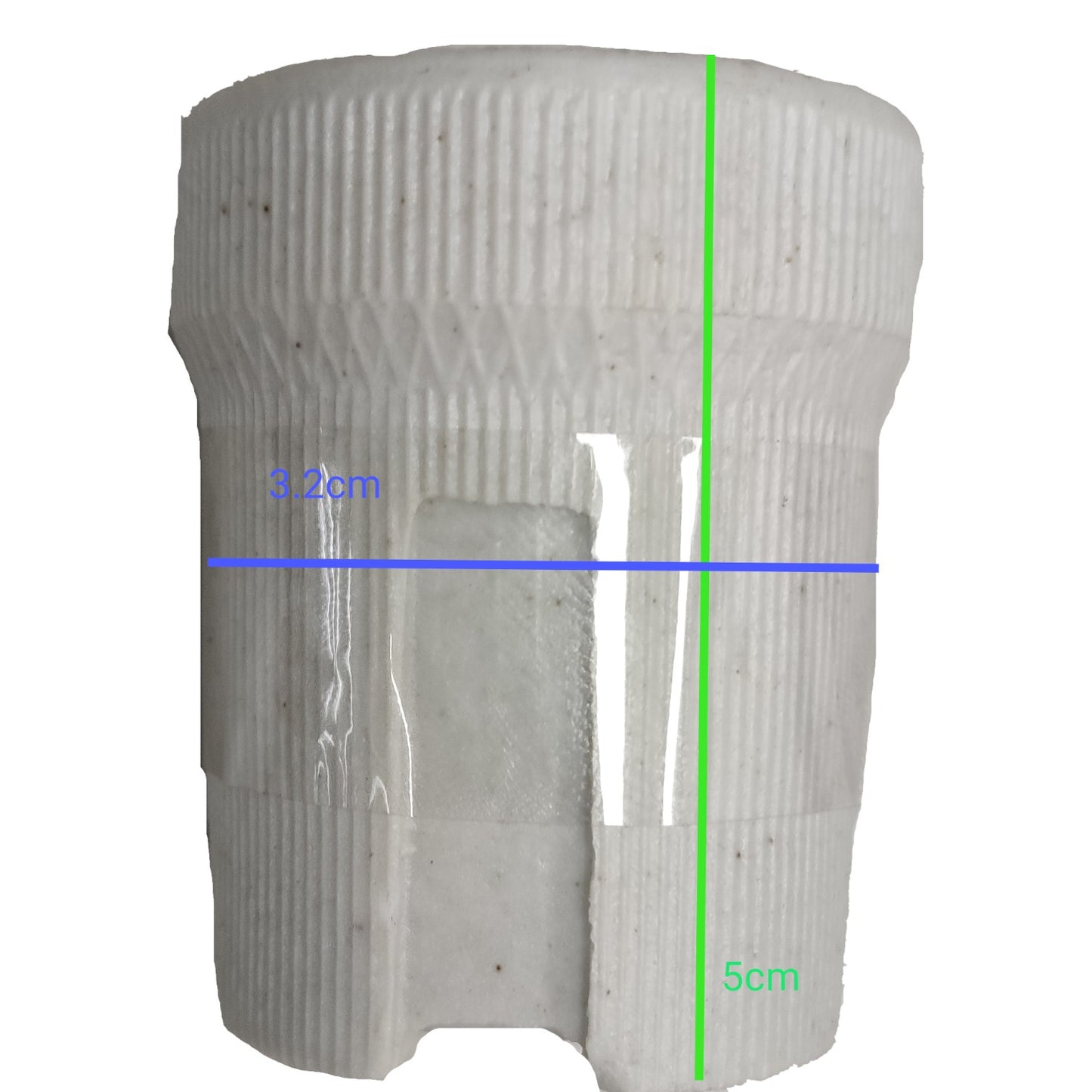 White cylindrical object with measurements marked on a white background
