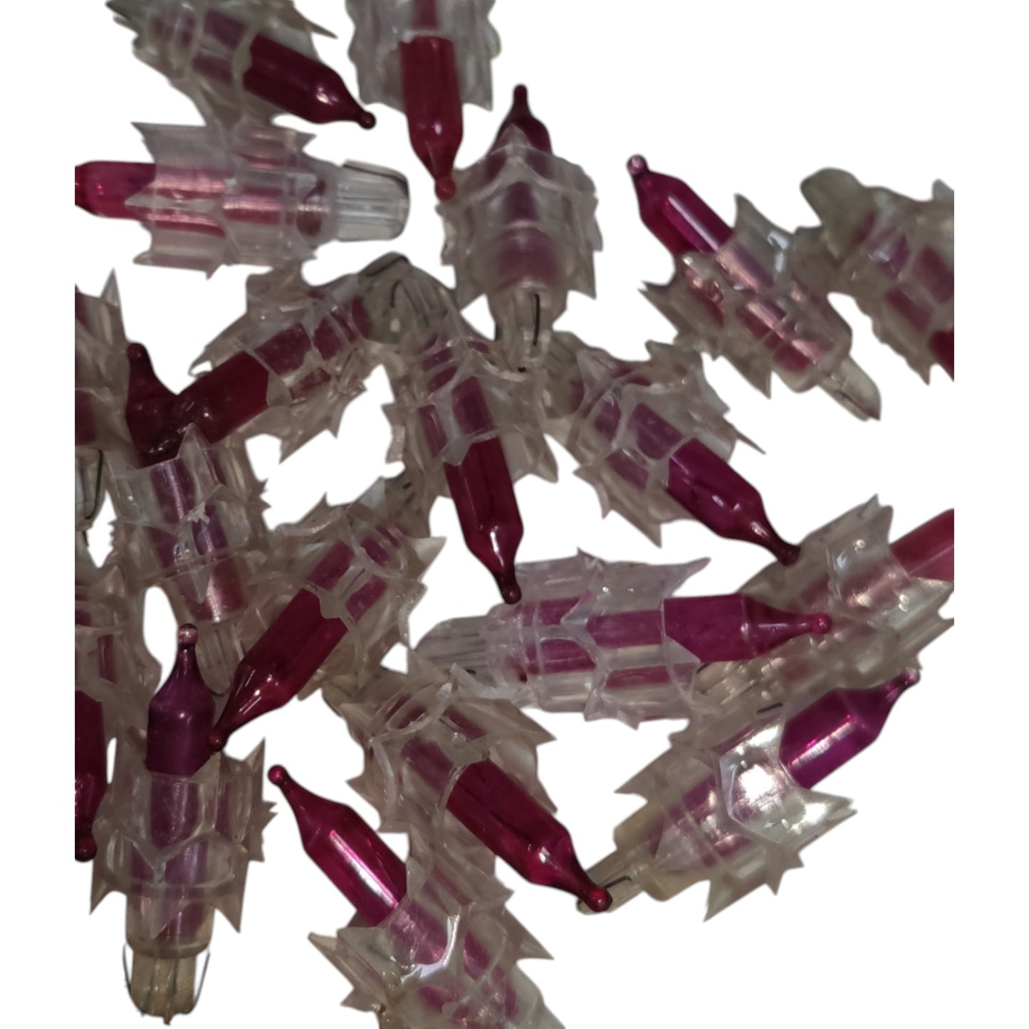 Cluster of red and clear plastic objects on a white background