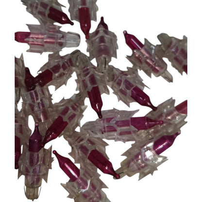 Cluster of red and clear plastic objects on a white background