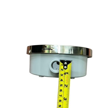 Metallic component with a tape measure for scale on a white  Cirtech Round Meter Base 1/2 inch Hub Electrical Meter Base KWH Meter Base 4 Jaws Electx Electrical Supplybackground