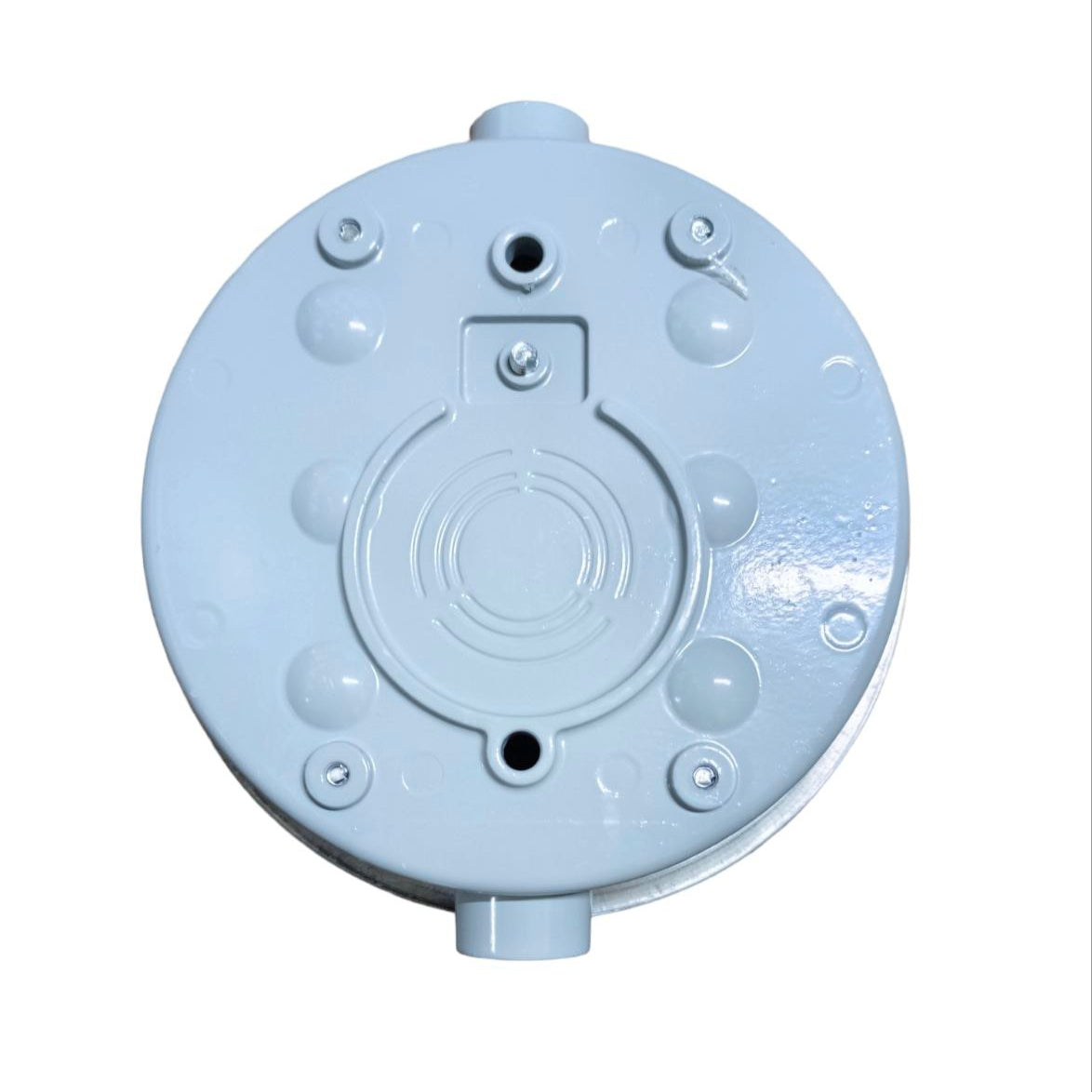 Round metallic object with threaded holes on a white background 
