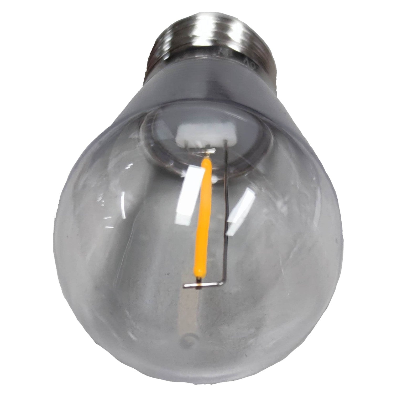 Clear light bulb with visible filament on a white background