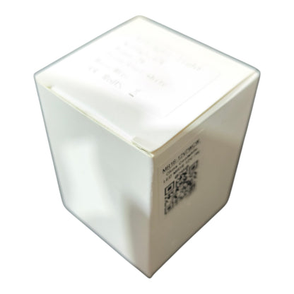White cube-shaped object with a QR code on a white background