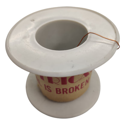 White thread spool with a cardboard core displaying 'America is Broken' text on a white background Enameled Copper Wire Magnet Wire AWG 42 0.06 mm Single Formix 500 Grams Approx 15625 Meters Per Roll Electx Electrical Supply