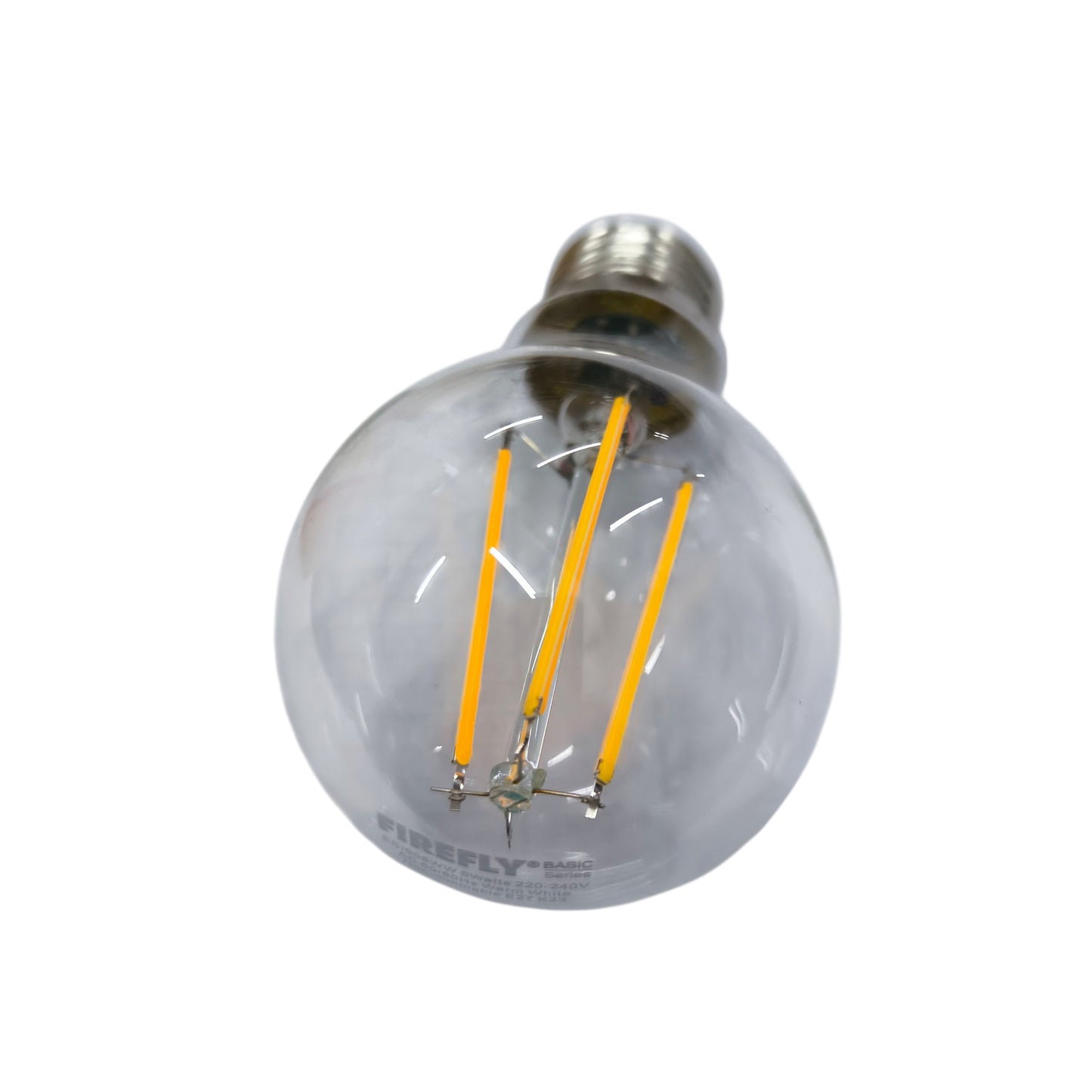 Clear LED light bulb with visible filaments on a white background