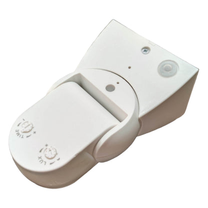 White electronic device with buttons on a white background