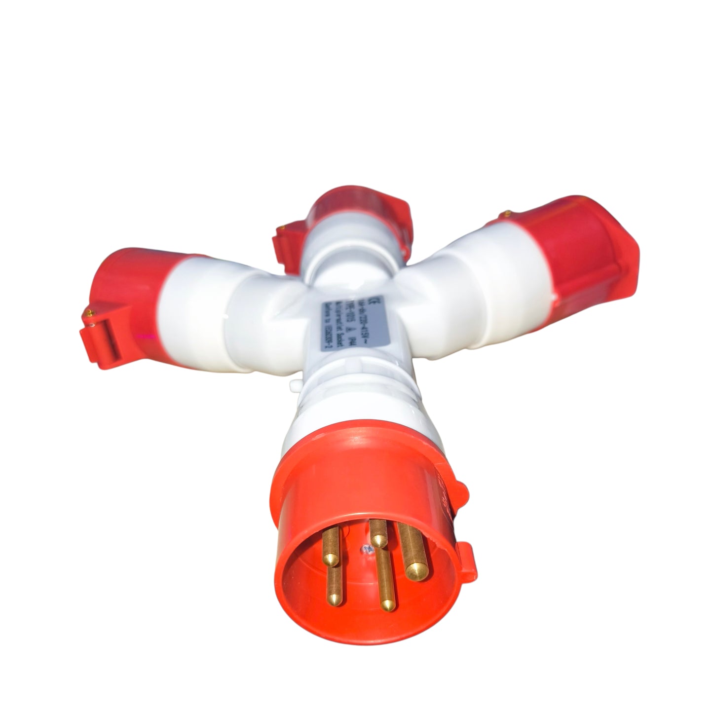 Red and white plastic fitting with brass connectors on a white background
