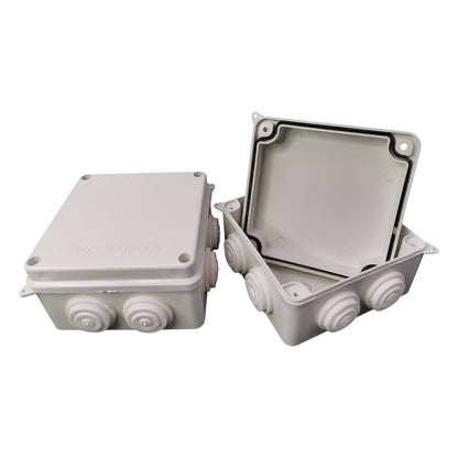 White plastic junction box with a cover on a white background