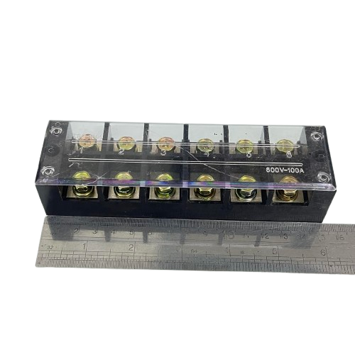 Grippes 100A 6 Pairs Terminal Block with clear cover and brass screws on black base shown with ruler