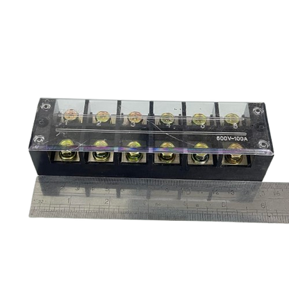 Grippes 100A 6 Pairs Terminal Block with clear cover and brass screws on black base shown with ruler