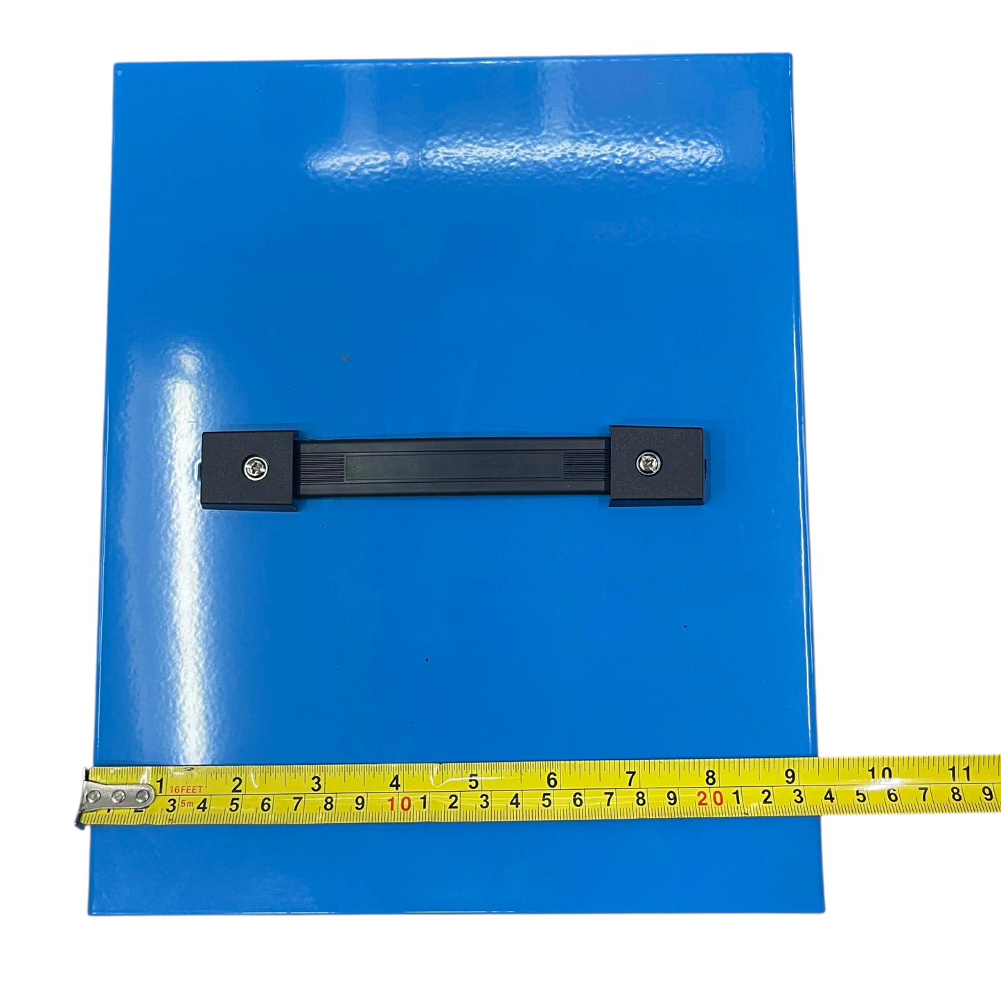 Blue sheet with a black strap and a yellow measuring tape for scale on a white background