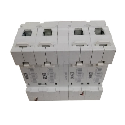 Stack of electrical circuit breakers on a white background