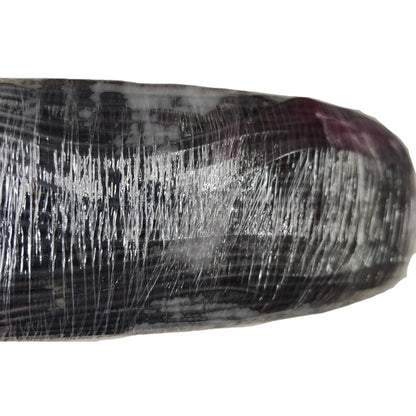 Close-up of a textured black and white object on a white background
