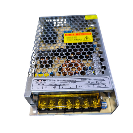 Switching power supply unit with metallic honeycomb design on a white background