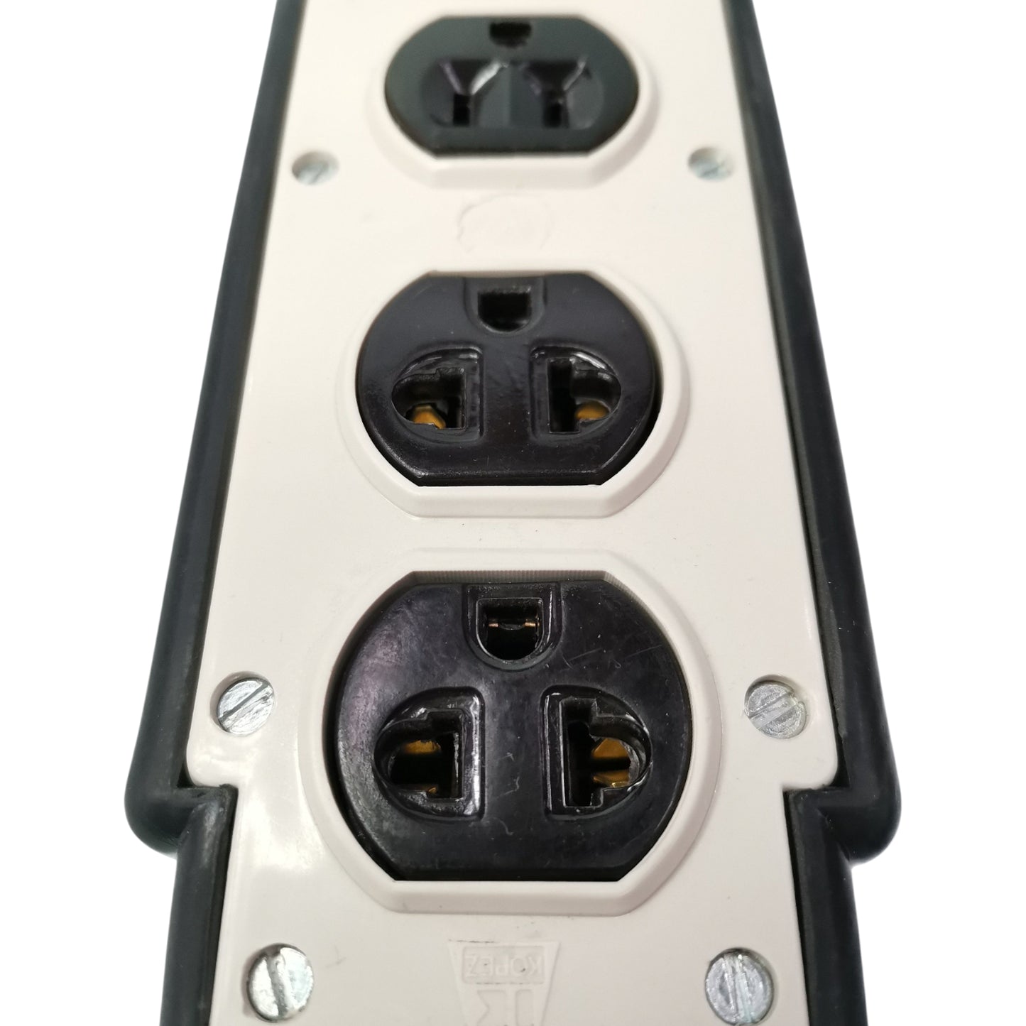 Close-up of a electrical outlet with three sockets on a white background