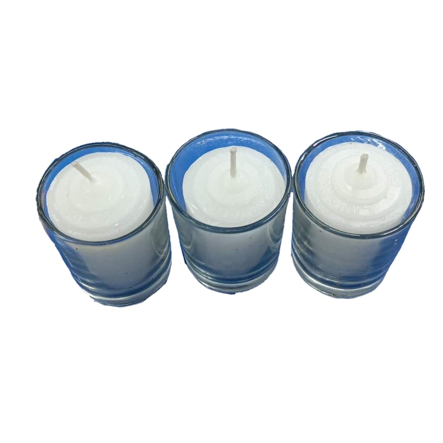 Three white candles in blue holders on a white background