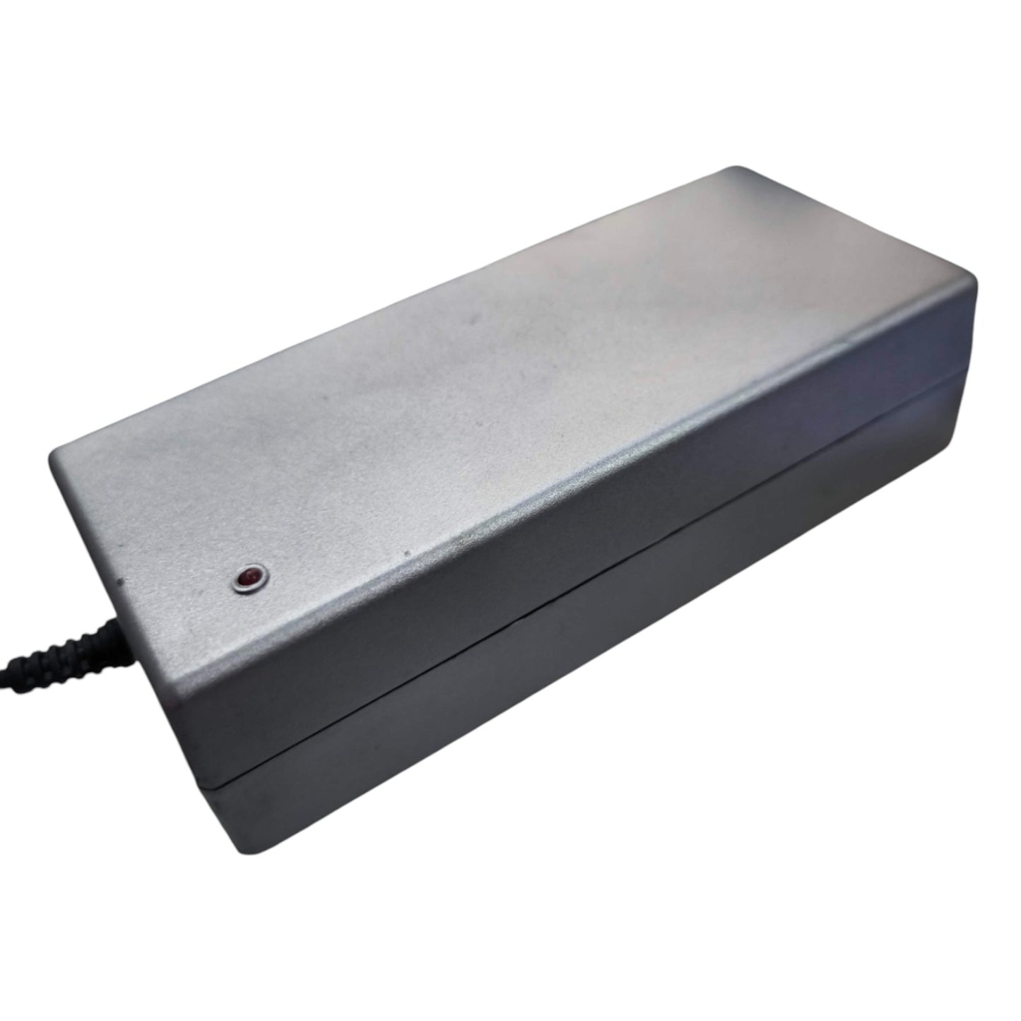 Rectangular metallic device with a power cord on a white background