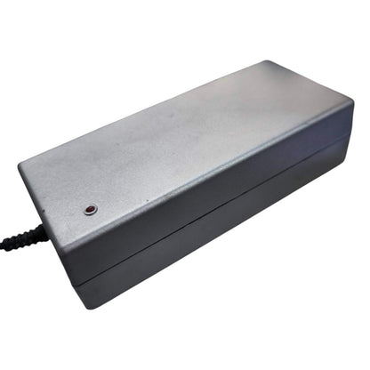 Rectangular metallic device with a power cord on a white background
