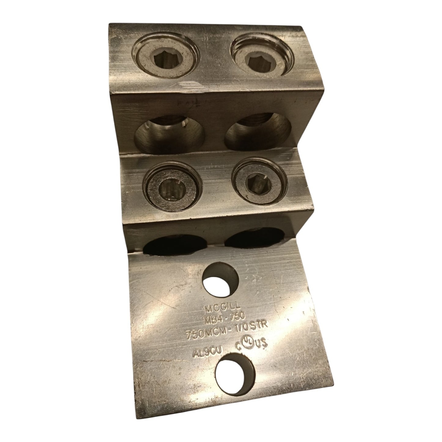 Metal component with multiple holes and engraved text on a white background