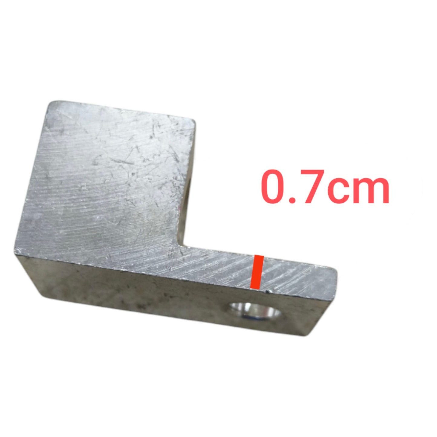 Metal L-shaped block with measurement '0.7cm' on a white background