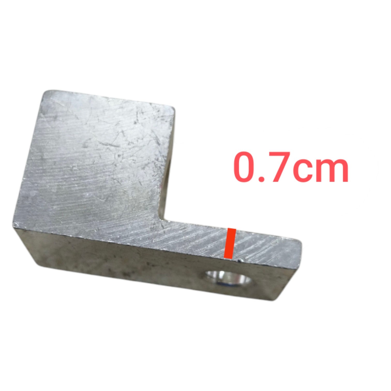 Metal L-shaped block with measurement '0.7cm' on a white background