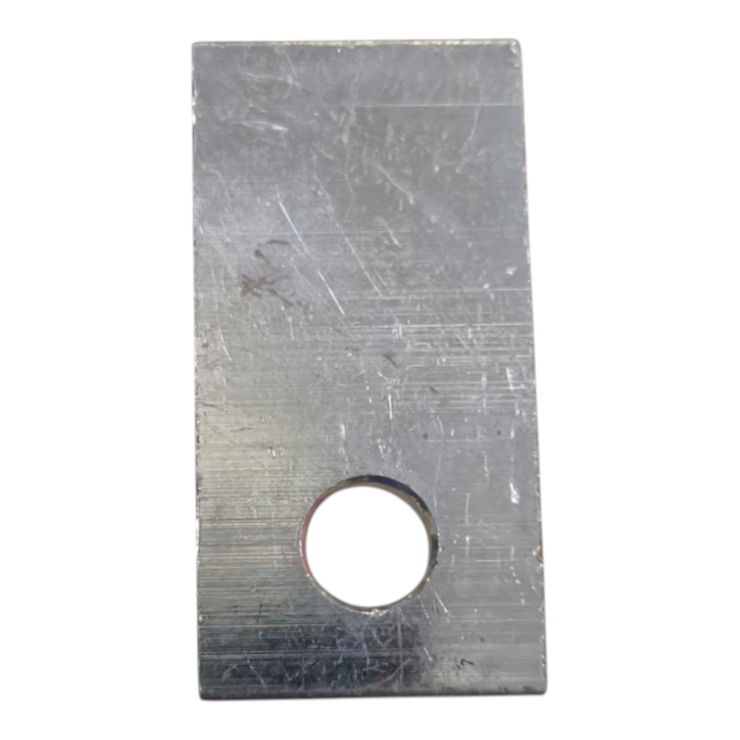 Rectangular metal plate with a central hole on a white background