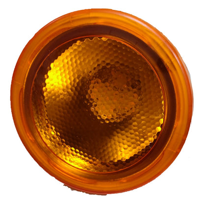 Round amber traffic light on a white background